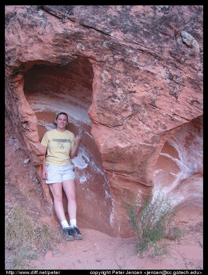 Ana in a neat sandstone formation in a wash we hiked down
