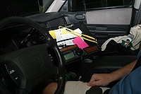 neat radio setup inside a member's truck. Clearance for a passenger is well provided for.