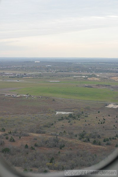 water tank and McKinney Falls State Park visible while on final for runway 35L