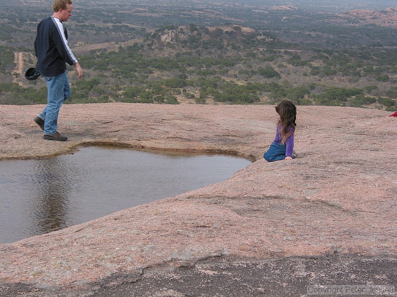 she almost fell in (which would have made a great picture!), but her father minded her to move away from the edge