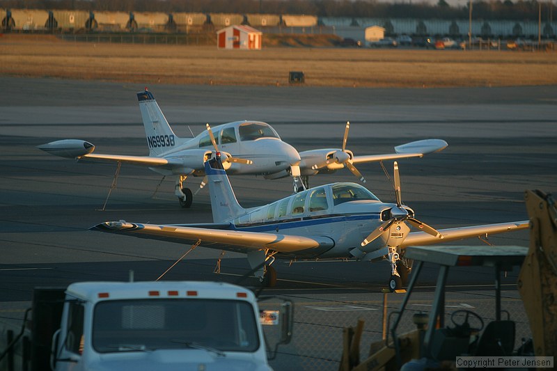 shot through a wire-filled glass window, but focus was far enough away that it's not too visible. Cessna 310Q and a Beech