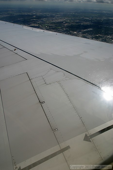 very thin layer of ice melting off from the descent through the clouds
