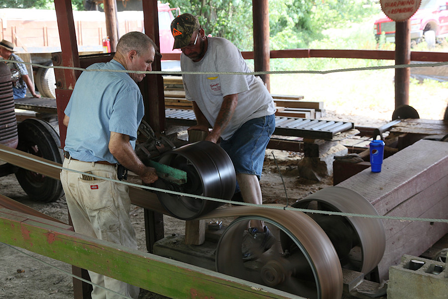 engaging the drive belt on the sawmill