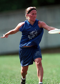 random picture of a woman playing ultimate with a standard 175g disc