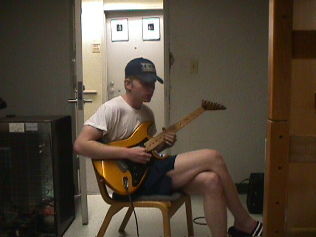 matt playing the guitar