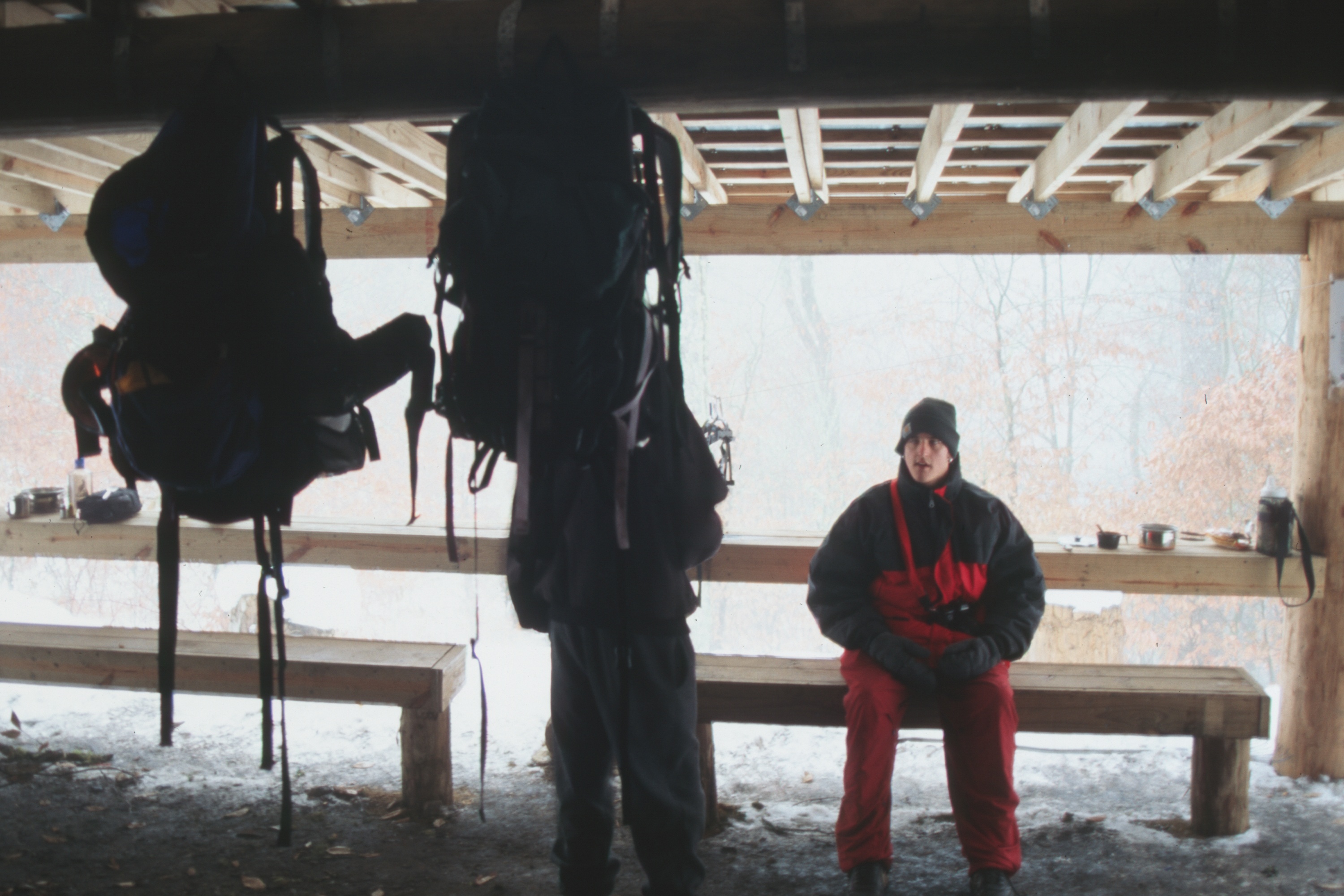 backpacks and folks in Peck's shelter