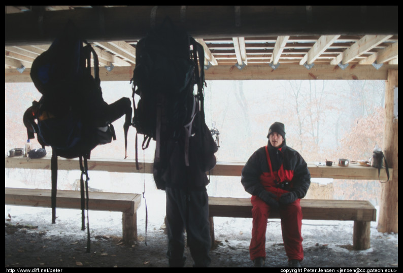 backpacks and folks in Peck's shelter