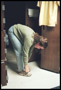 Melissa ties her shoe