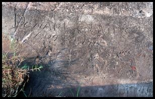 blairs old carport with kids footprints