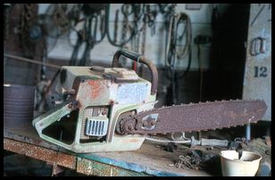 old chainsaw in barn