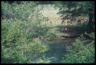 family by river