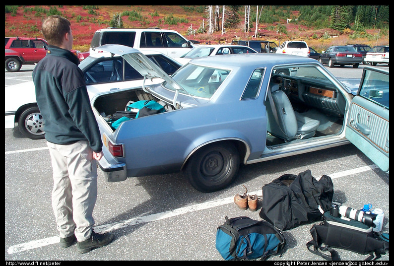 Charlie surveys the car and gear before we head out