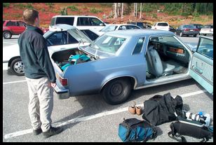 Charlie surveys the car and gear before we head out