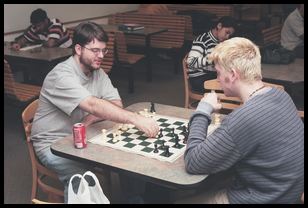 Bryan and DJ play chess, with bounced flash