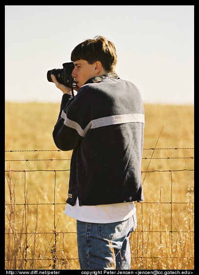 Myke shooting at the fence