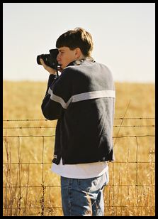 Myke shooting at the fence