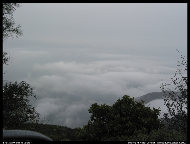 looking down out over the clouds