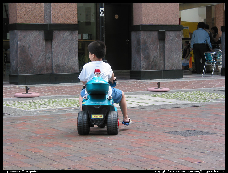 kid on electric scooter