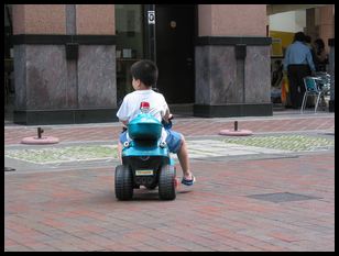 kid on electric scooter