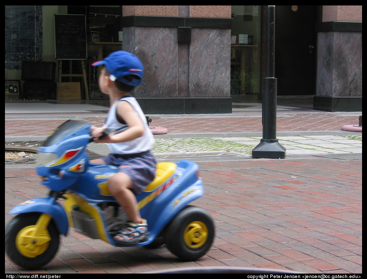 kid on electric scooter