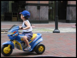 kid on electric scooter