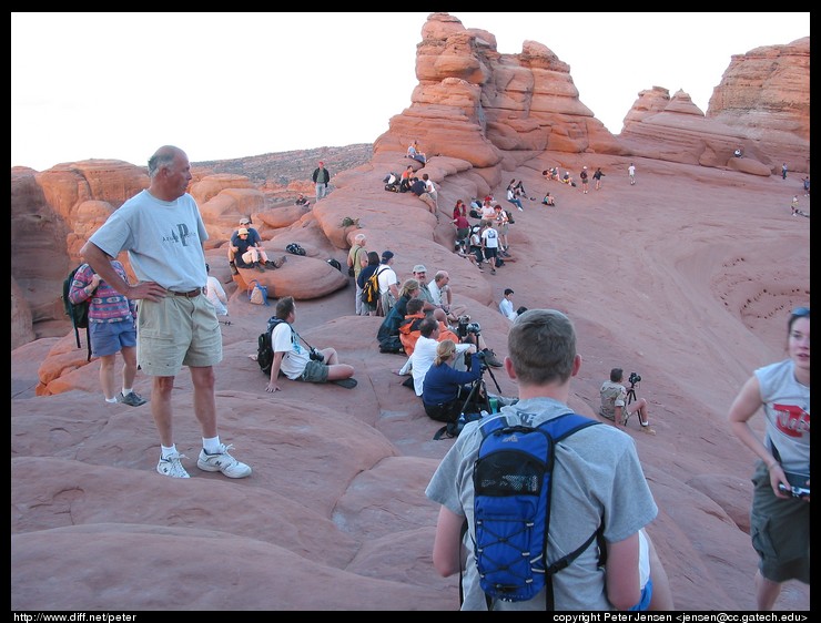 photographers and viewers preparing for sunset