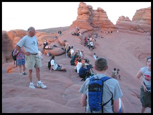 photographers and viewers preparing for sunset