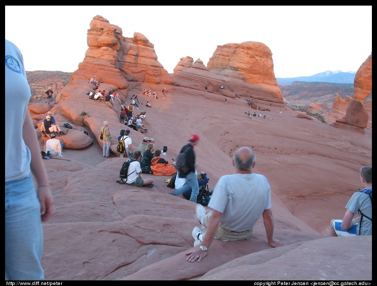 photographers and viewers preparing for sunset