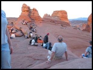 photographers and viewers preparing for sunset