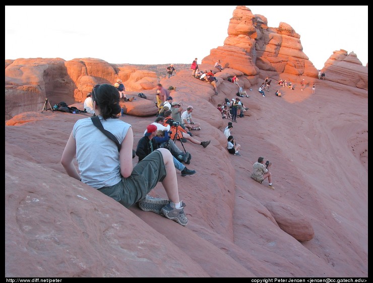 photographers and viewers preparing for sunset