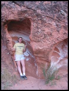 Ana in a neat sandstone formation in a wash we hiked down