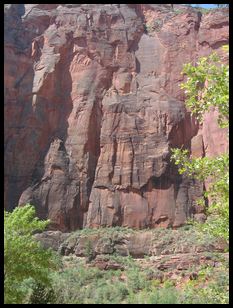 climbers on a multi-pitch multi-day route (look to the left of the rightmost tree leaves)