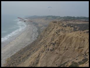 a hang glider coming toward us