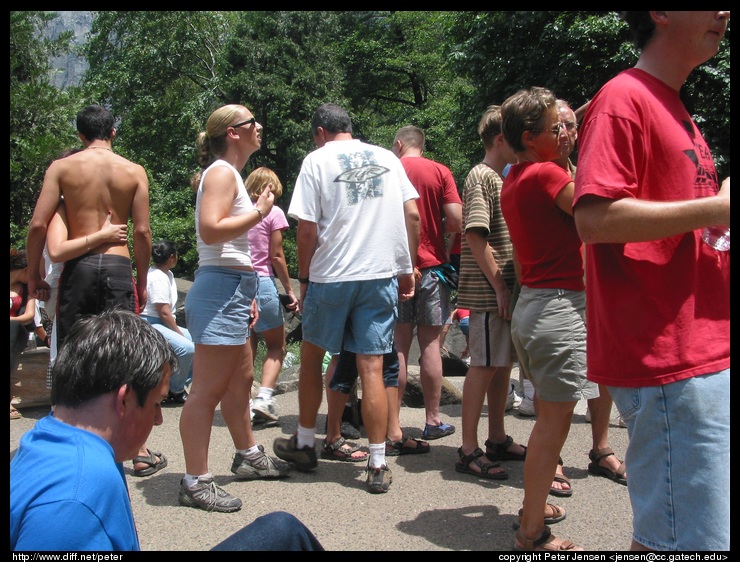 random human masses around the base of the falls