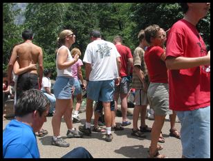 random human masses around the base of the falls