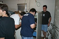 Phil, Charles, Tim, and John installing the new repeater in the rack
