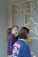 sorority sisters creating homecoming decorations