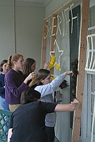 sorority sisters creating homecoming decorations