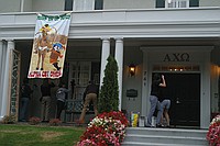 sorority sisters creating homecoming decorations