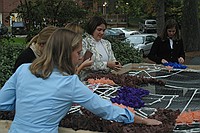 sorority sisters creating homecoming decorations