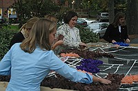 sorority sisters creating homecoming decorations