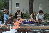 sorority sisters creating homecoming decorations