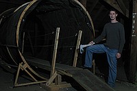 Michael Clements, staff advisor for the Towers Harrison residence halls, stands in front of what will soon be the rotating tunnel as freshmen transform the Towers attic into the Towers Haunted House.