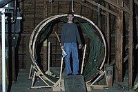 Michael Clements, staff advisor for the Towers Harrison residence halls, stands in front of what will soon be the rotating tunnel as freshmen transform the Towers attic into the Towers Haunted House.