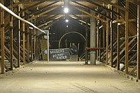 Michael Clements, staff advisor for the Towers Harrison residence halls, stands in front of what will soon be the rotating tunnel as freshmen transform the Towers attic into the Towers Haunted House.