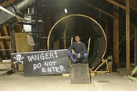 Michael Clements, staff advisor for the Towers Harrison residence halls, stands in front of what will soon be the rotating tunnel as freshmen transform the Towers attic into the Towers Haunted House.