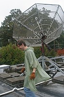 Chris C. in front of a dish on the roof of the WREK studio