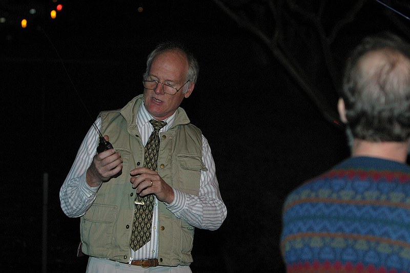 Bob Bruninga giving a demonstration of satellite APRS to onlookers