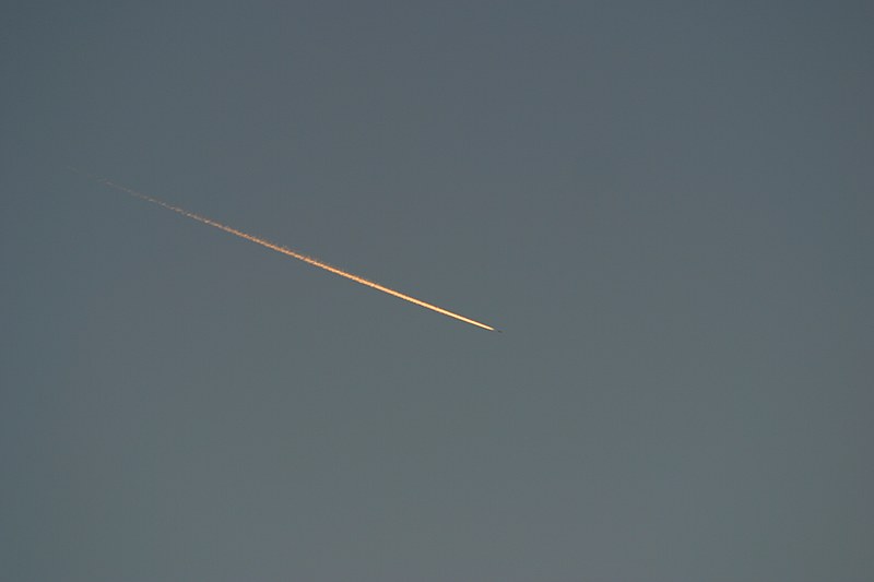 neat alpenglow on the contrail