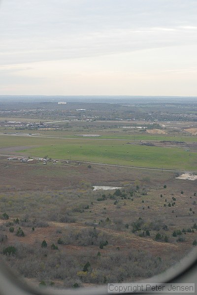water tank and McKinney Falls State Park visible while on final for runway 35L